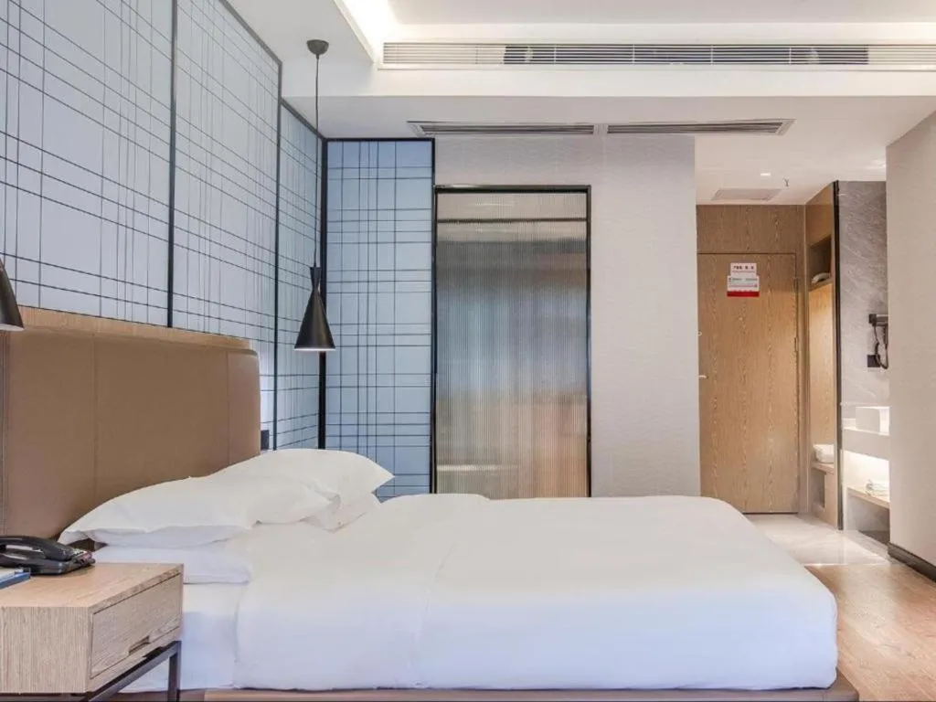 Bed in Echarm Hotel Changsha Yueliangdao Guanziling Metro Station