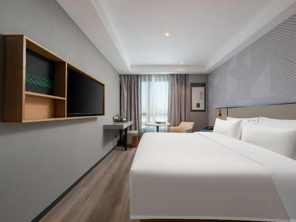 Bed in Borrman Hotel Beijing Guomao Jinsong Metro Station