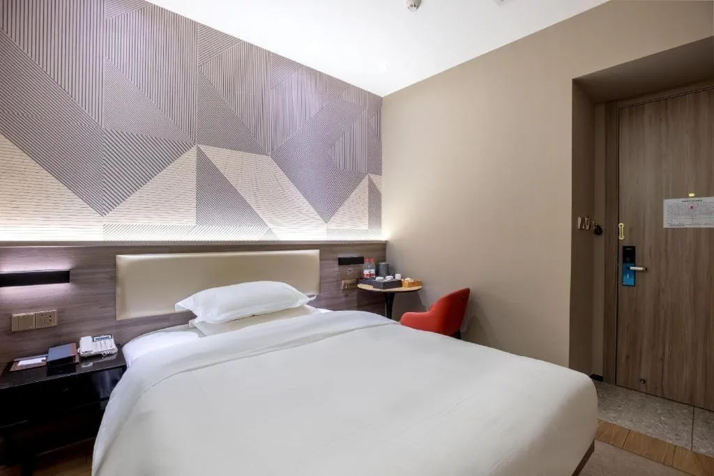 Bed in Borrman Hotel Korla Peacock River