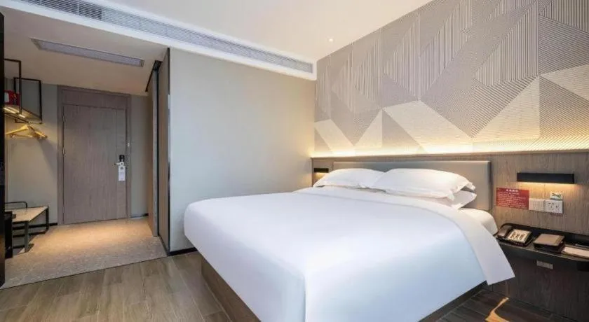 Bed in Borrman Hotel Korla Peacock River