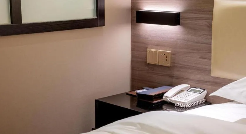 Bed in Borrman Hotel Korla Peacock River