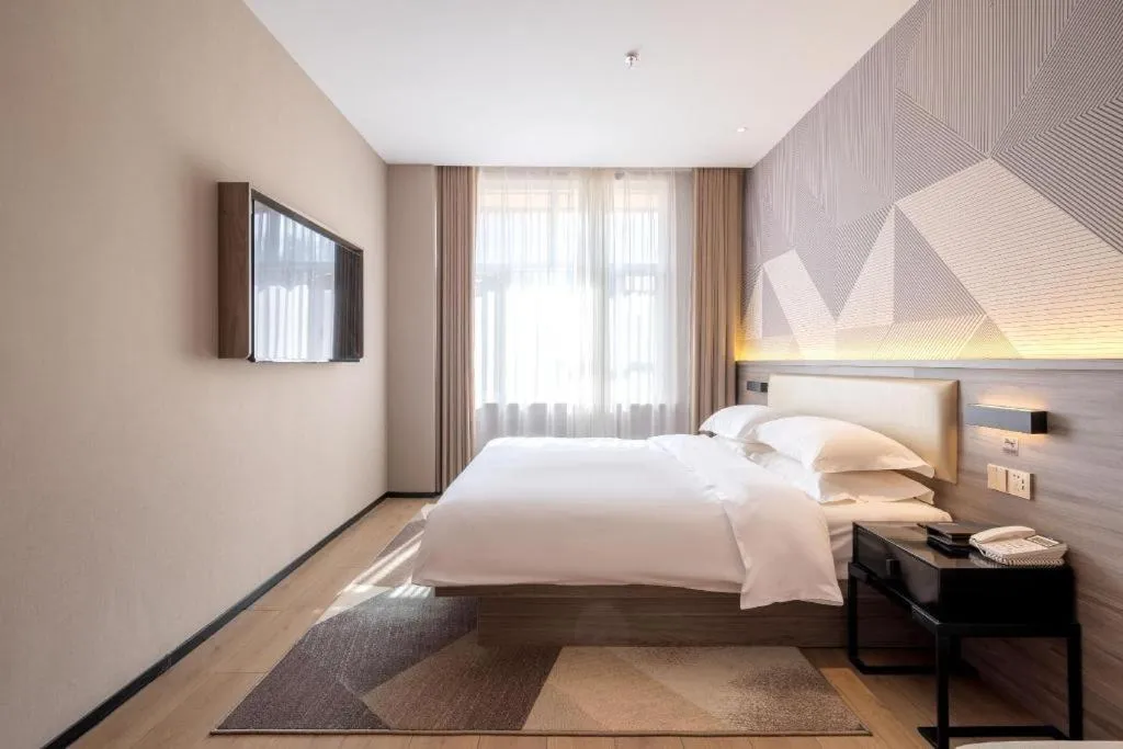 Bed in Borrman Hotel Korla Peacock River