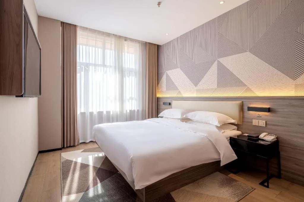 Bed in Borrman Hotel Korla Peacock River