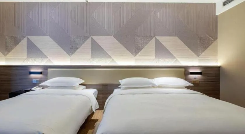 Bed in Borrman Hotel Korla Peacock River