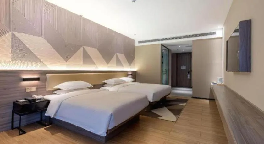 Bed in Borrman Hotel Korla Peacock River