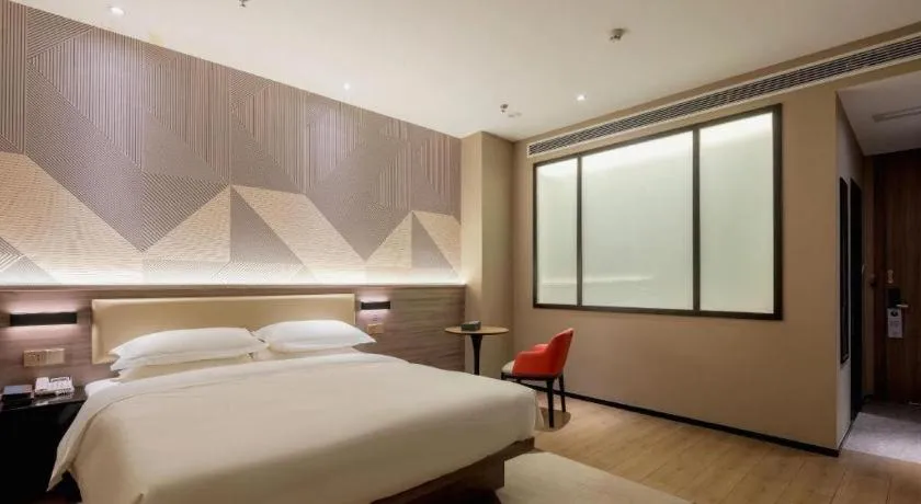 Bed in Borrman Hotel Korla Peacock River