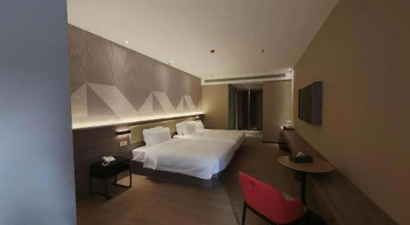 Bed in Borrman Hotel Korla Peacock River