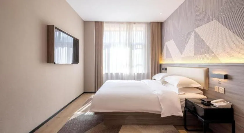 Bed in Borrman Hotel Korla Peacock River