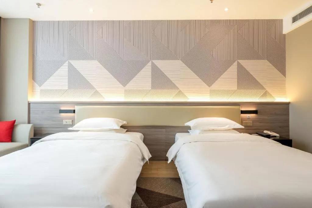 Bed in Borrman Hotel Korla Peacock River