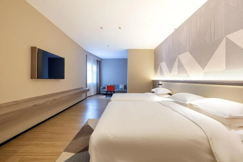 Bed in Borrman Hotel Korla Peacock River