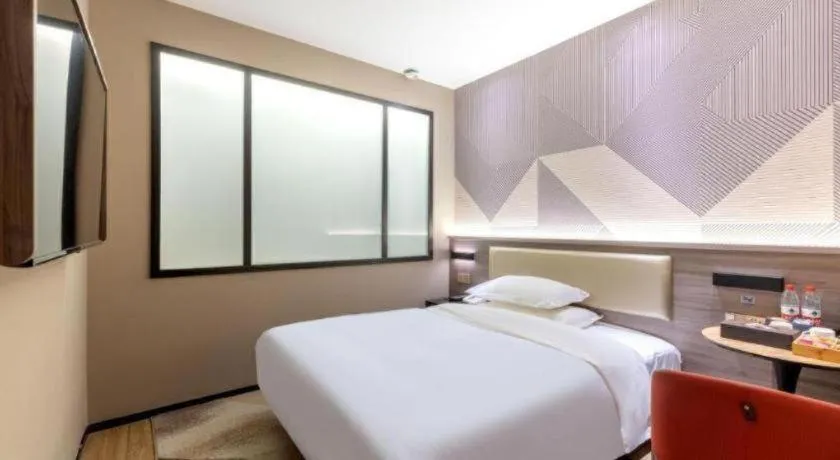 Bed in Borrman Hotel Korla Peacock River