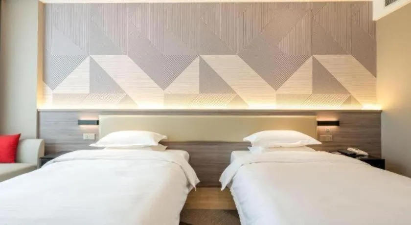 Bed in Borrman Hotel Korla Peacock River