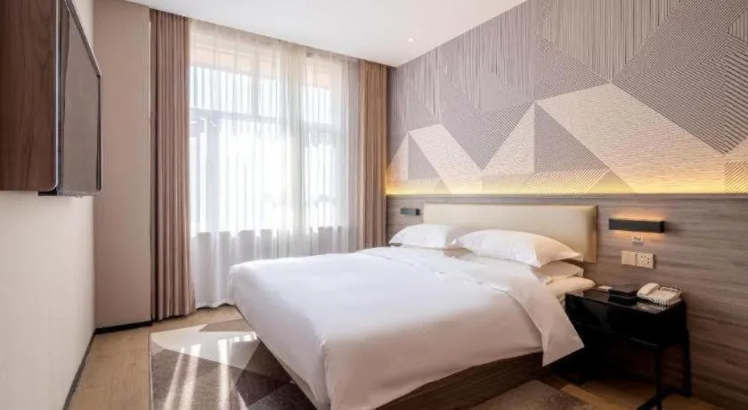 Bed in Borrman Hotel Korla Peacock River