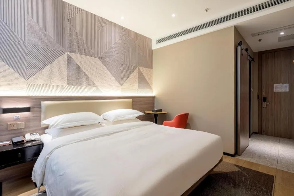 Bed in Borrman Hotel Korla Peacock River