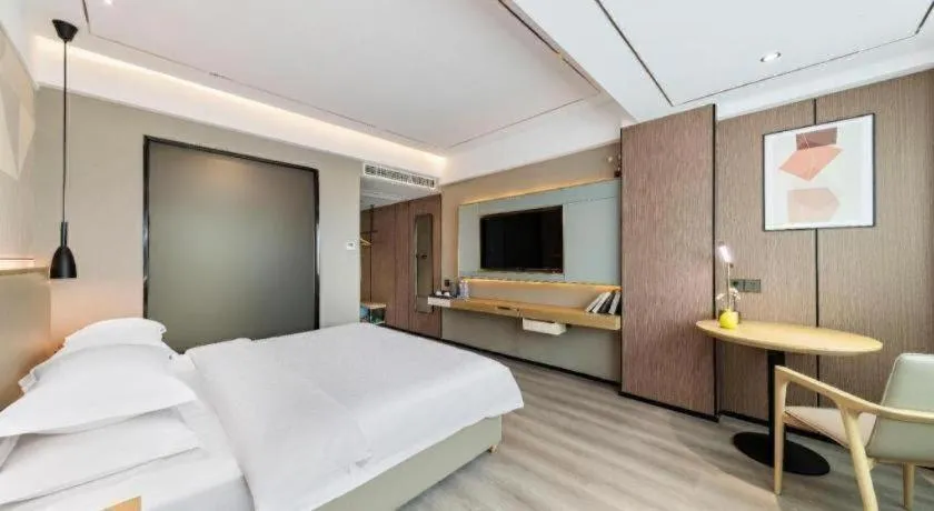 Bed in Borrman Hotel Wanning Wenming Road High-speed Railway Station