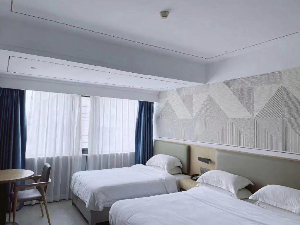 Bed in Borrman Hotel Wanning Wenming Road High-speed Railway Station