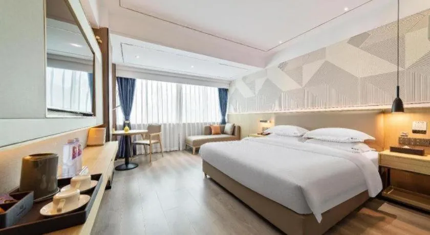 Bed in Borrman Hotel Wanning Wenming Road High-speed Railway Station