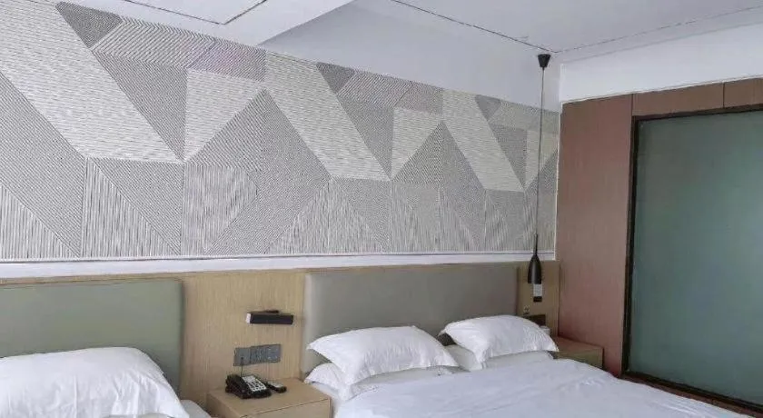 Bed in Borrman Hotel Wanning Wenming Road High-speed Railway Station