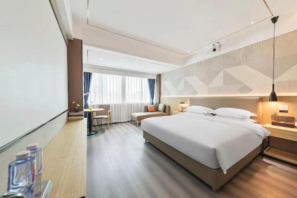 Bed in Borrman Hotel Wanning Wenming Road High-speed Railway Station