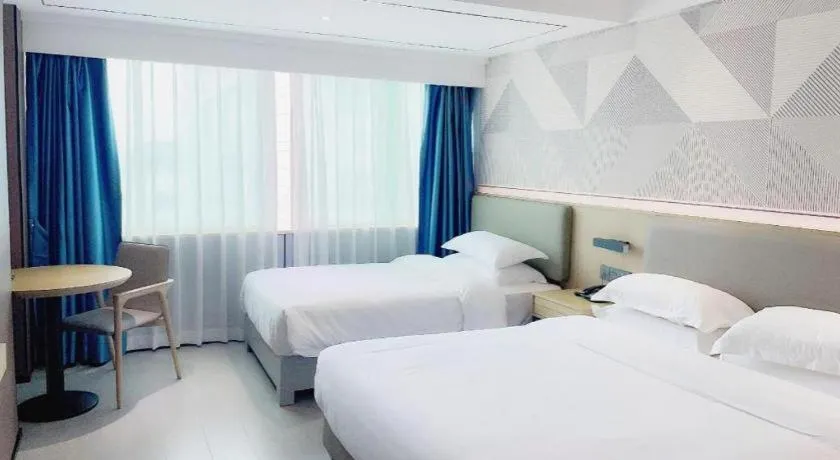 Bed in Borrman Hotel Wanning Wenming Road High-speed Railway Station