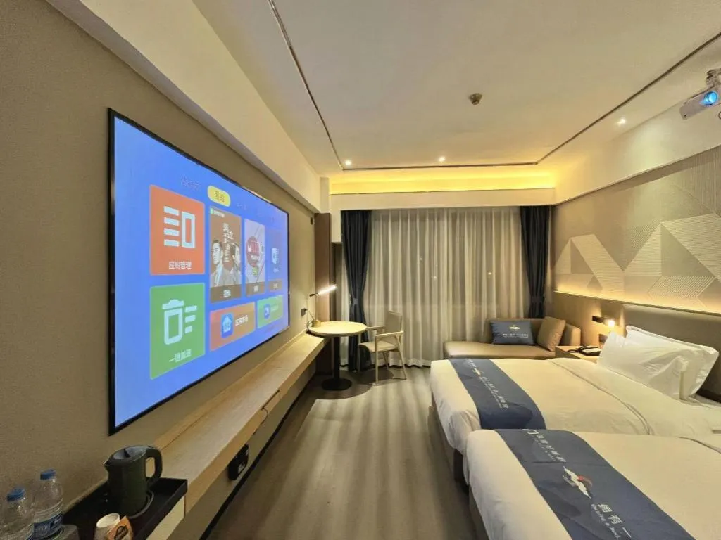 Bed in Borrman Hotel Wanning Wenming Road High-speed Railway Station