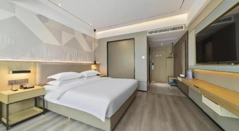 Bed in Borrman Hotel Wanning Wenming Road High-speed Railway Station