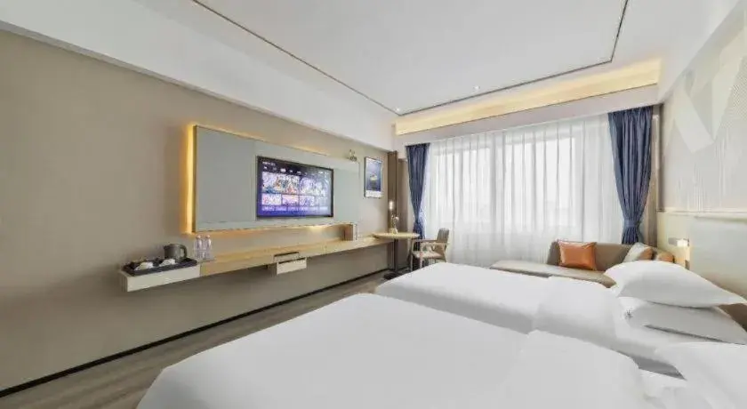 Bed in Borrman Hotel Wanning Wenming Road High-speed Railway Station Bed in Borrman Hotel Wanning Wenming Road High-speed Railway Station