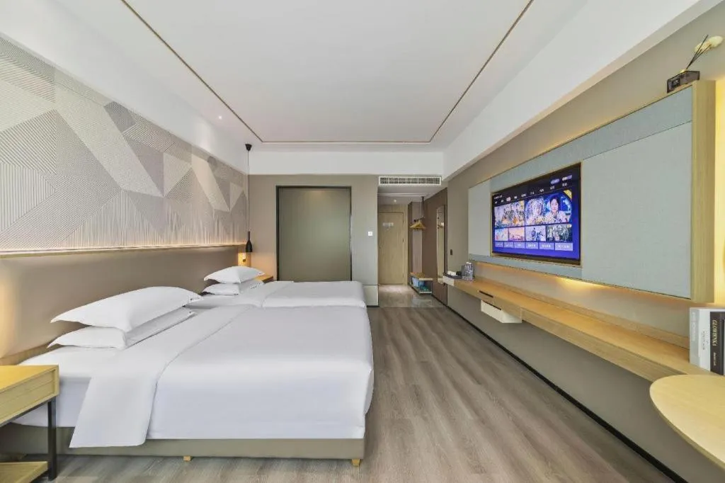 Bed in Borrman Hotel Wanning Wenming Road High-speed Railway Station