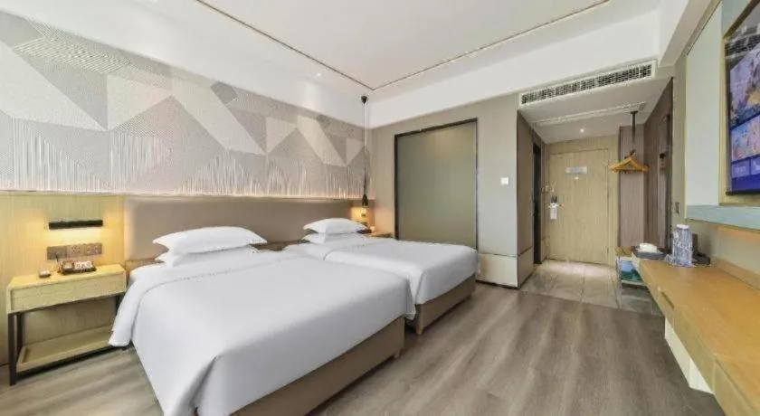 Bed in Borrman Hotel Wanning Wenming Road High-speed Railway Station