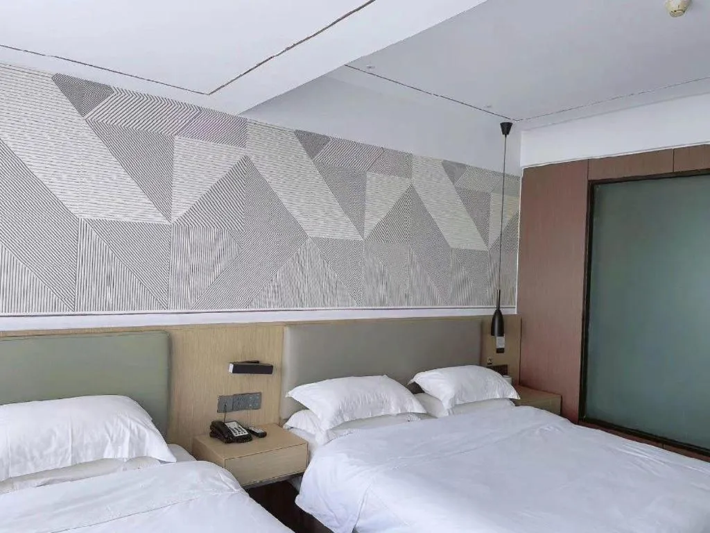 Bed in Borrman Hotel Wanning Wenming Road High-speed Railway Station