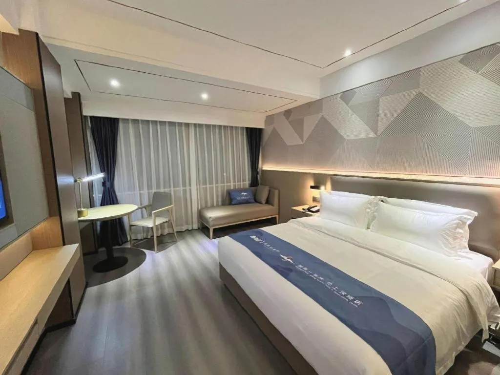 Bed in Borrman Hotel Wanning Wenming Road High-speed Railway Station