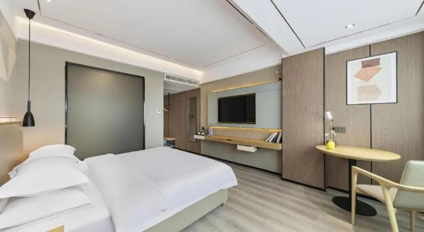 Bed in Borrman Hotel Wanning Wenming Road High-speed Railway Station