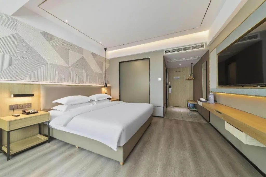 Bed in Borrman Hotel Wanning Wenming Road High-speed Railway Station