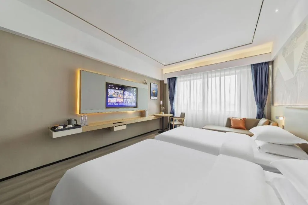 Bed in Borrman Hotel Wanning Wenming Road High-speed Railway Station