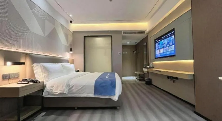 Bed in Borrman Hotel Wanning Wenming Road High-speed Railway Station