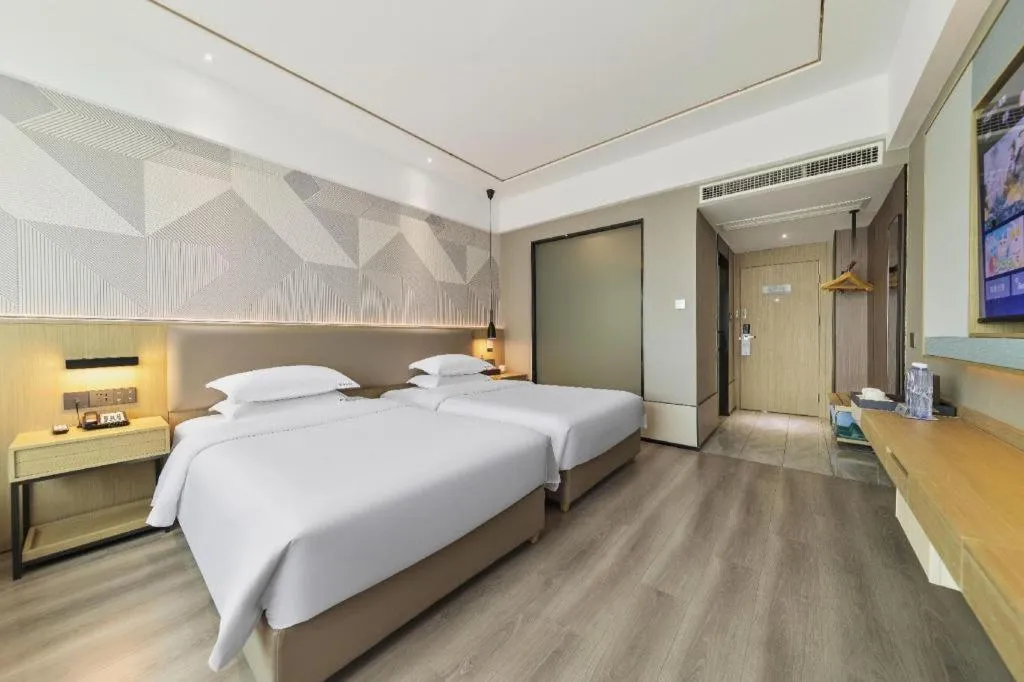 Bed in Borrman Hotel Wanning Wenming Road High-speed Railway Station