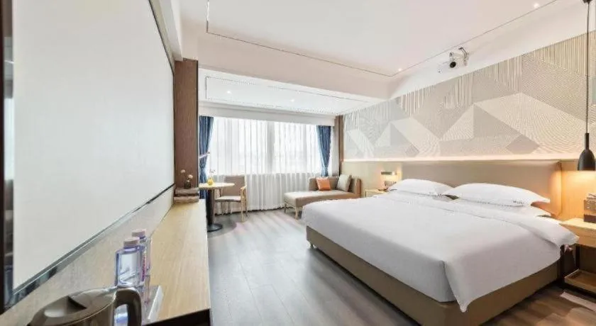 Bed in Borrman Hotel Wanning Wenming Road High-speed Railway Station