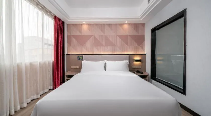 Bed in Borrman Hotel Guangzhou Xinshi Baixin Plaza Qifu Road