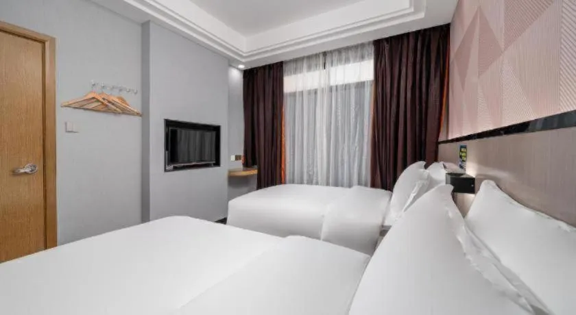 Bed in Borrman Hotel Guangzhou Xinshi Baixin Plaza Qifu Road