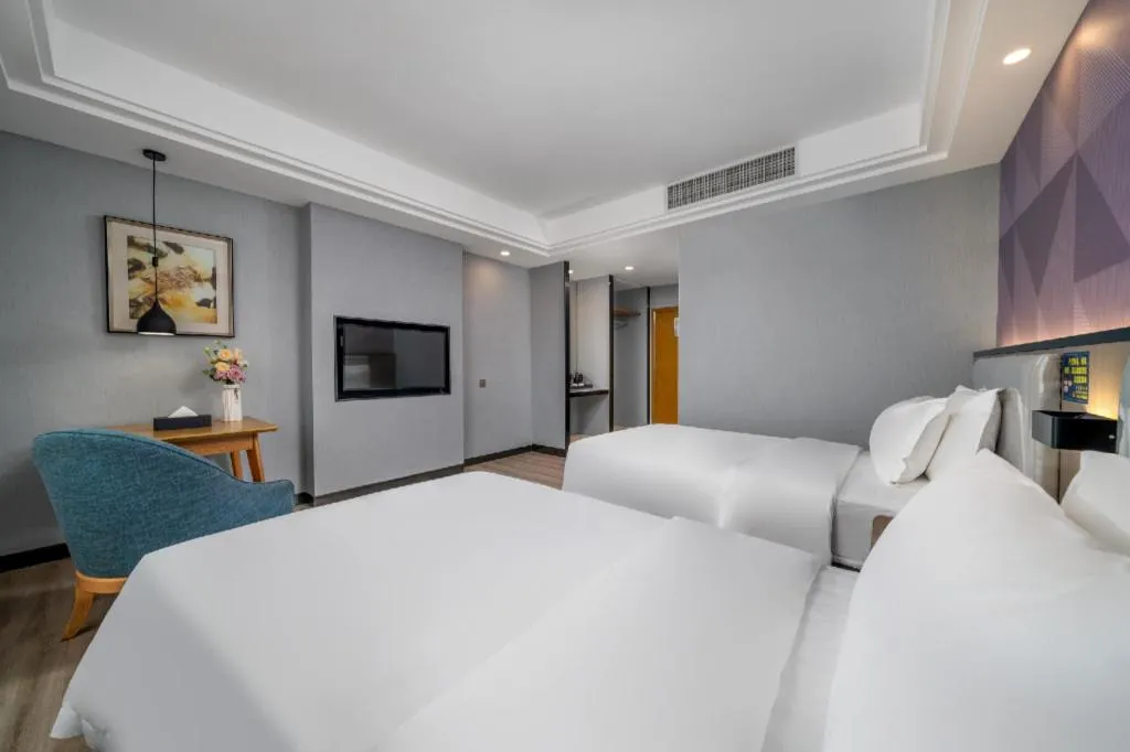 Bed in Borrman Hotel Guangzhou Xinshi Baixin Plaza Qifu Road
