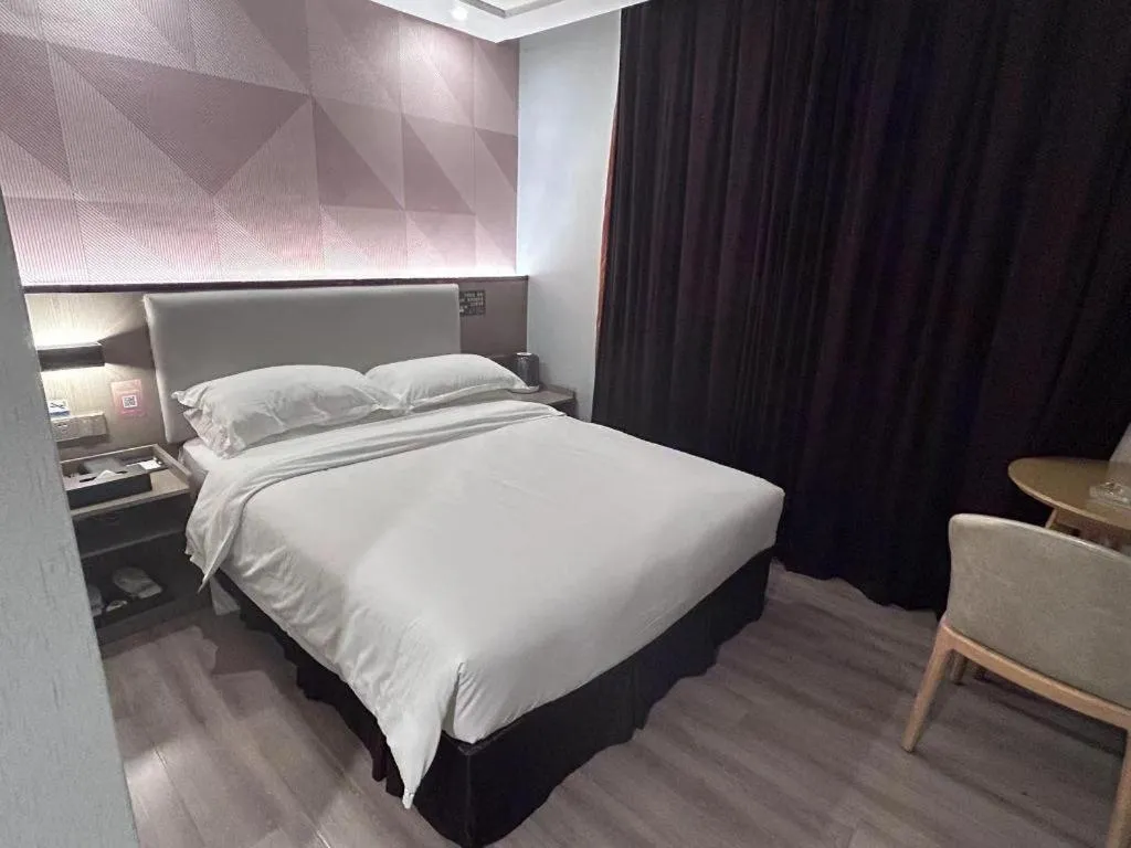 Bed in Borrman Hotel Guangzhou Xinshi Baixin Plaza Qifu Road