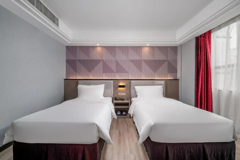 Bed in Borrman Hotel Guangzhou Xinshi Baixin Plaza Qifu Road