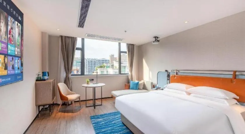 Bed in Echarm Hotel Guangzhou North Station Cultural Tourism City