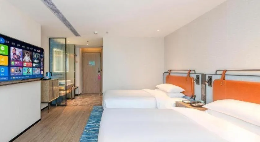 Bed in Echarm Hotel Guangzhou North Station Cultural Tourism City