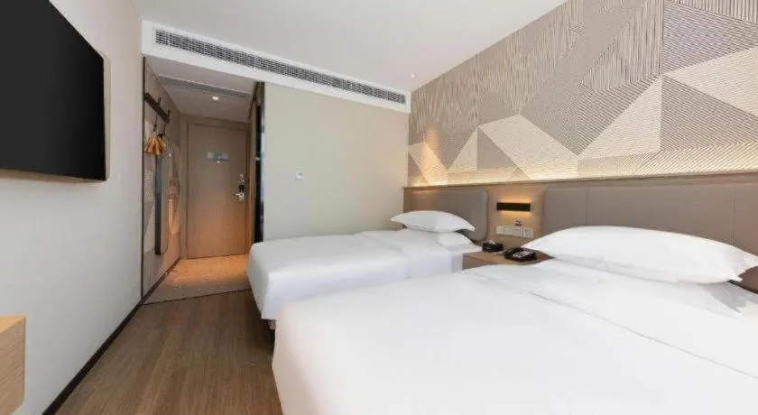 Bed in Borrman Hotel Wuhan First Hospital Hanzheng Street Metro Station