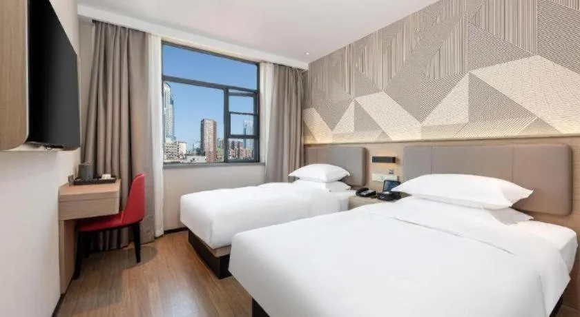 Bed in Borrman Hotel Wuhan First Hospital Hanzheng Street Metro Station