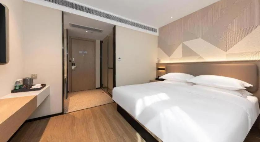 Bed in Borrman Hotel Wuhan First Hospital Hanzheng Street Metro Station