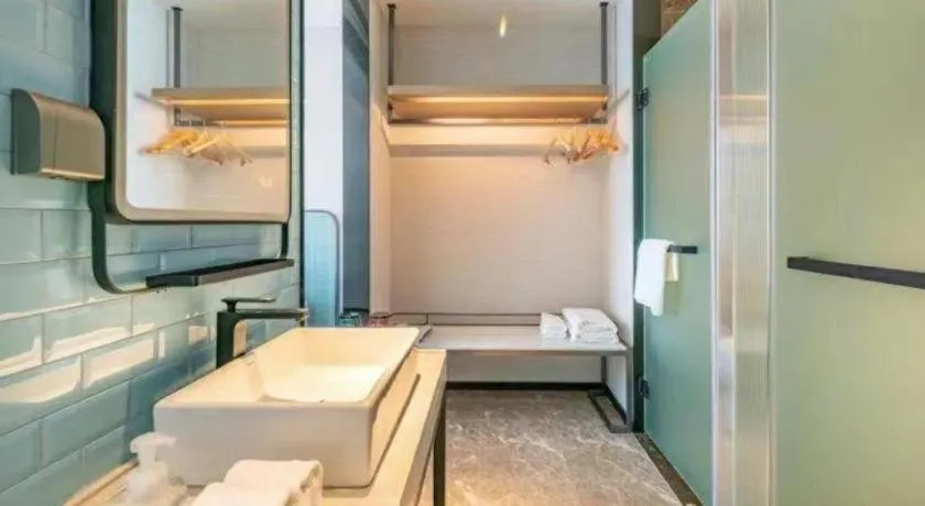 Bed in Echarm Hotel Zigong Machishui Wanda Plaza