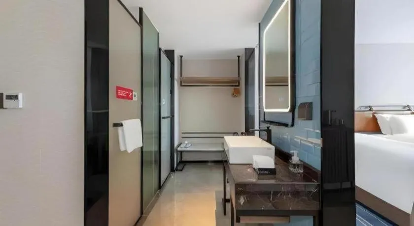 Bed in Echarm Hotel Zigong Machishui Wanda Plaza