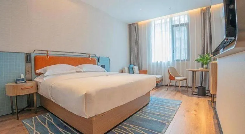 Bed in Echarm Hotel Zigong Machishui Wanda Plaza